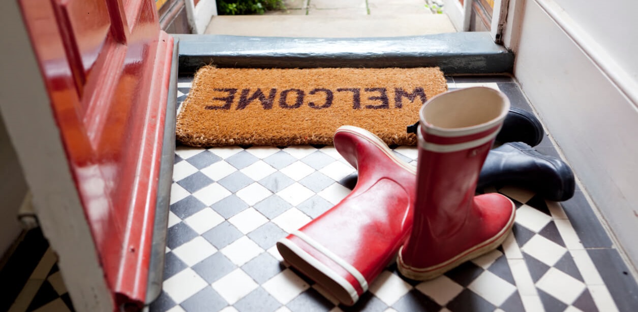 Wellies on a door mat