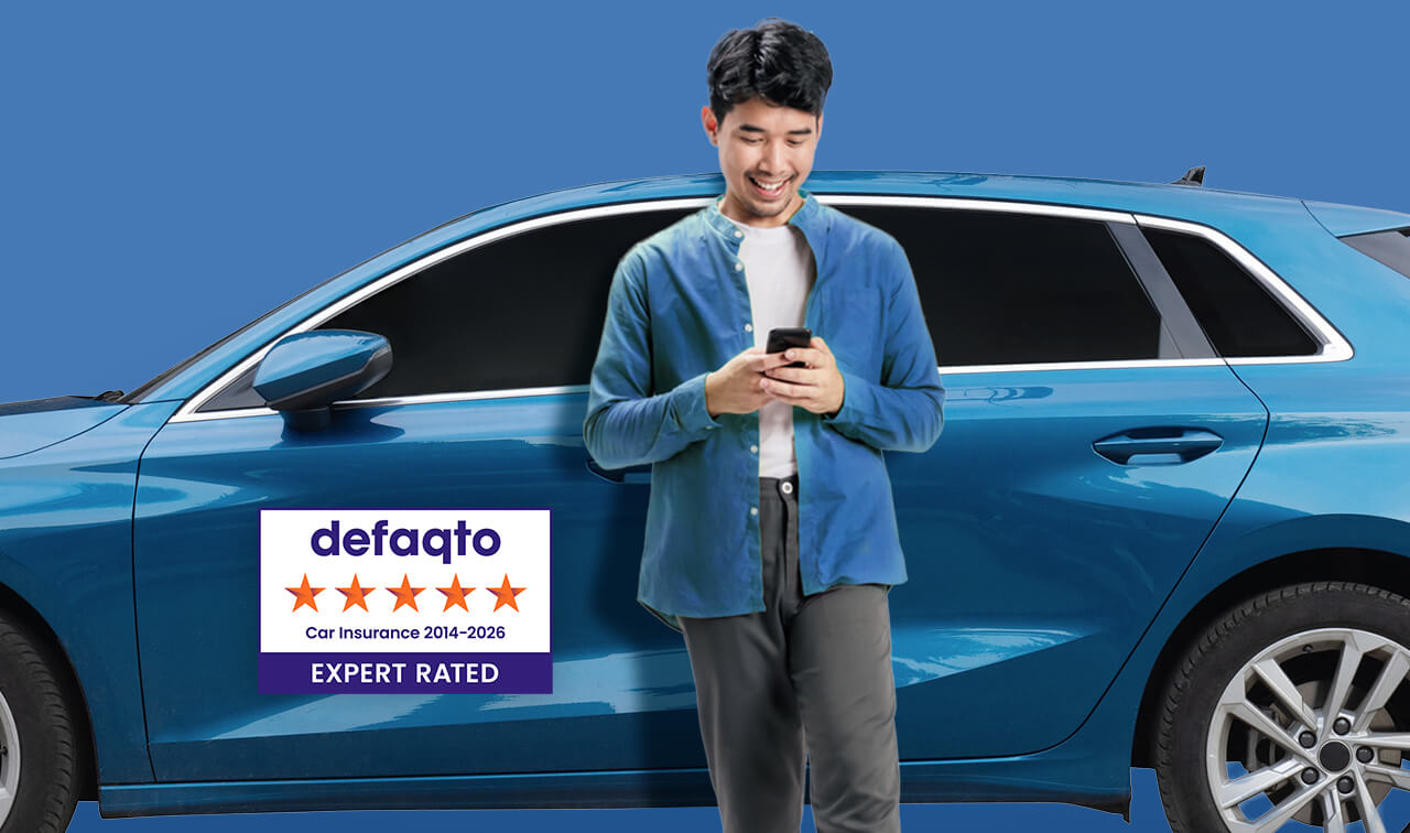 Man leans against blue car