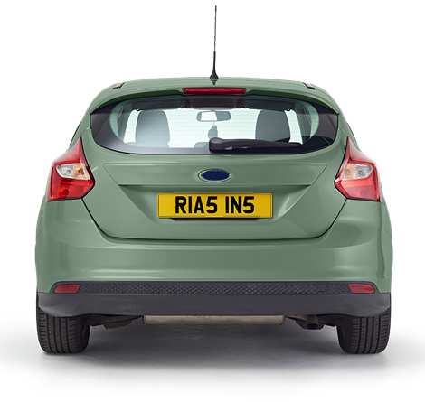 The back of a mint green coloured car with a personalised Rias plate
