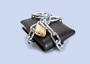 A wallet with a chain and lock around it on a blue background