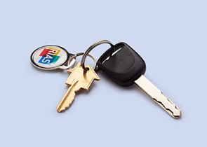 Set of keys with a Rias keyring on a blue background