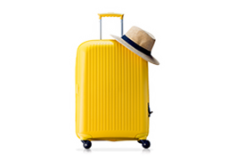 Yellow suitcase and a hat