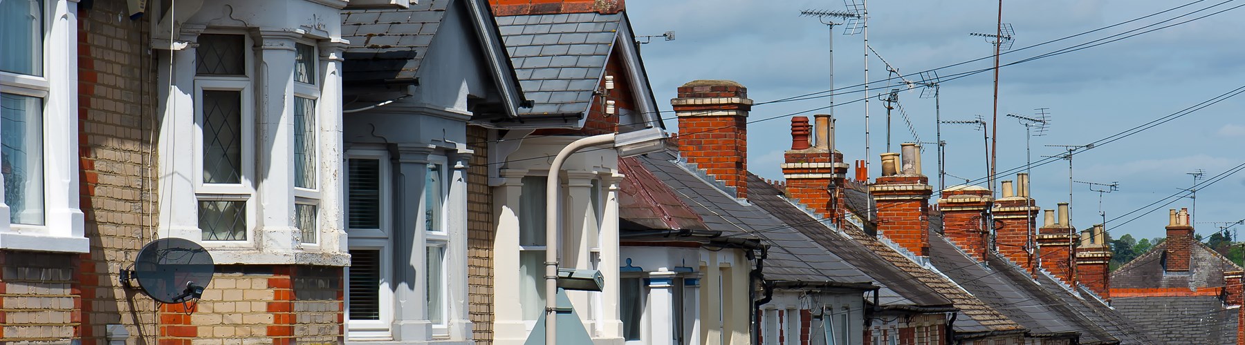 Row of brick houses with aerials