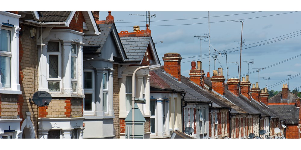 Row of brick houses with aerials