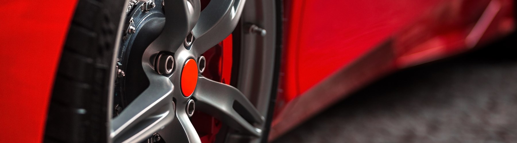Modified wheels on red car