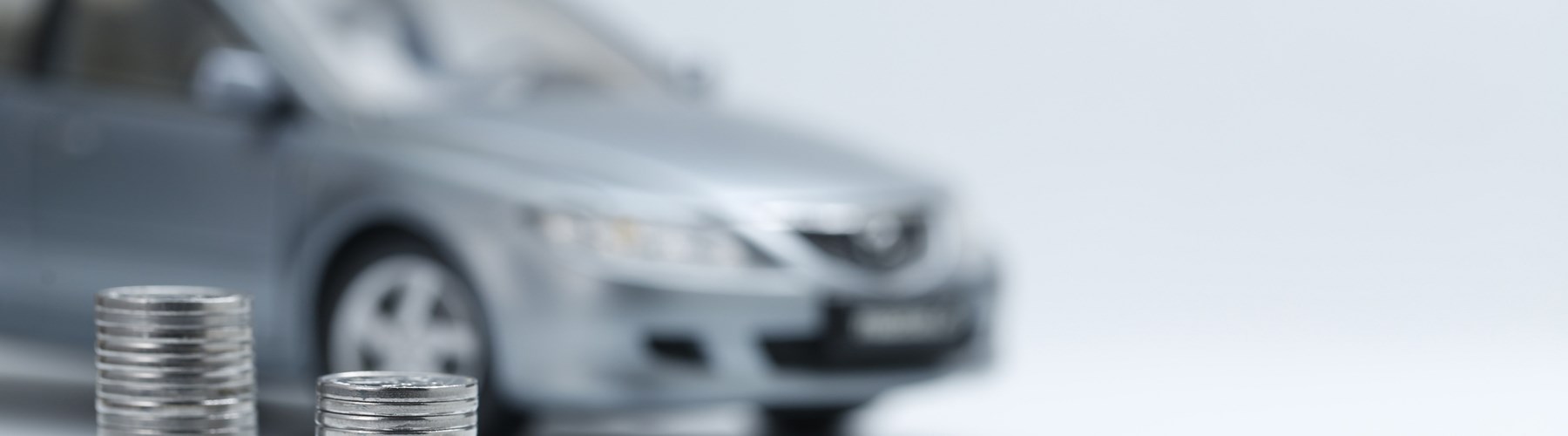 Silver car and coins