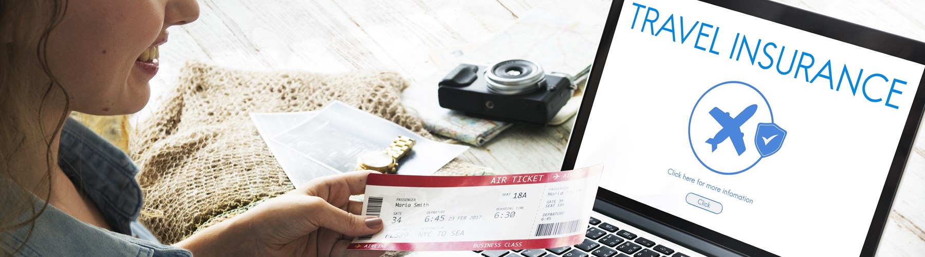 Young woman buying travel insurance online