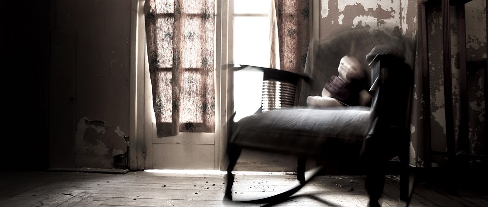Haunted house with doll on rocking chair 