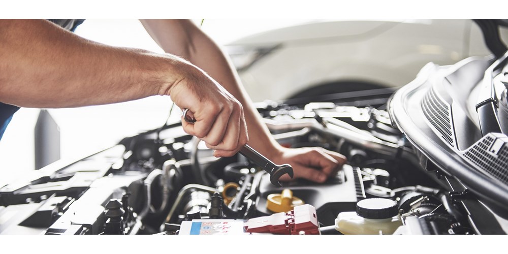 Man checking his car engine