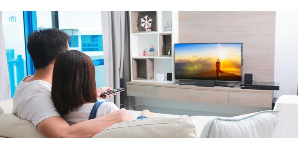 Couple watching TV in the living room