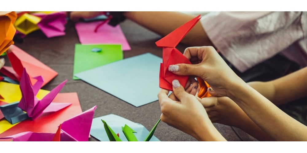 Woman's hands doing origami