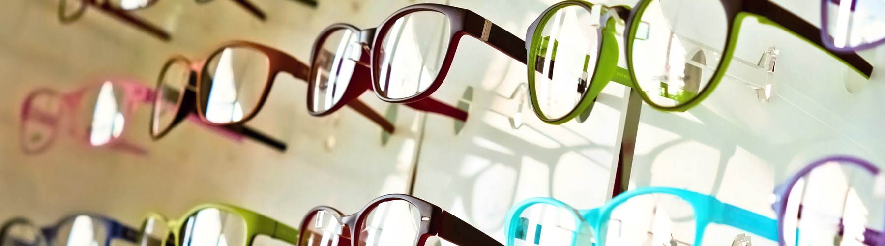 Variety of coloured glasses in opticians 