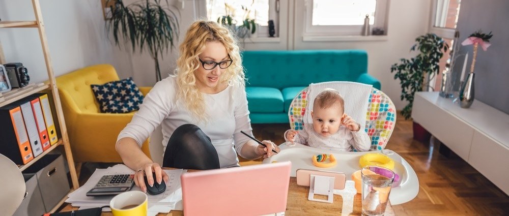 Mum working from home with baby