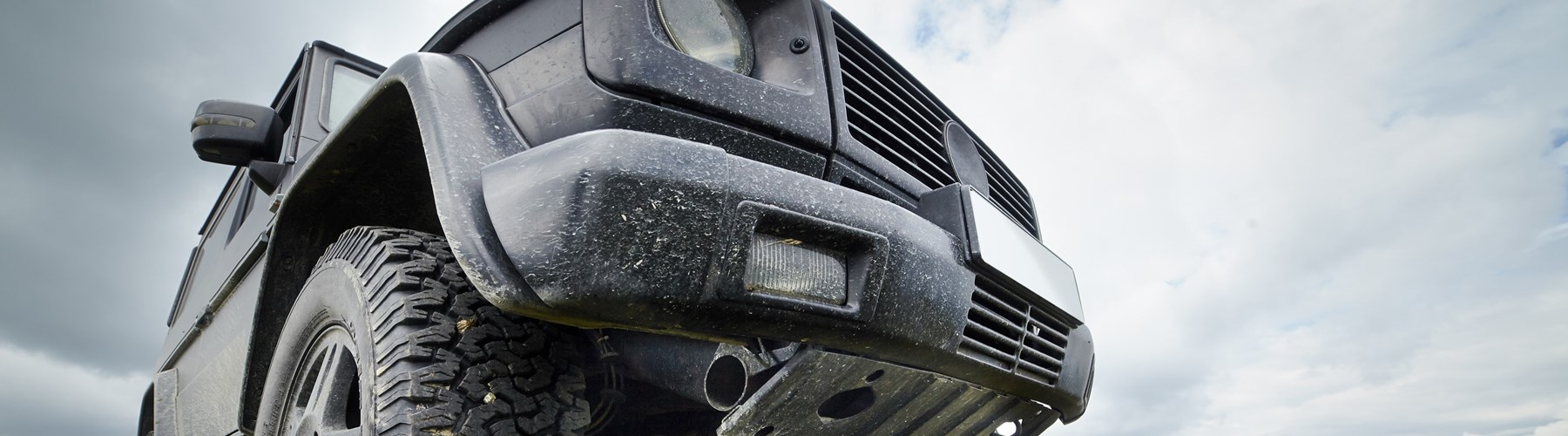 Close up image of black 4x4 car