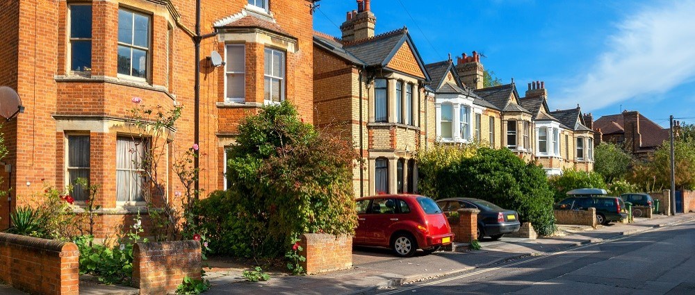 British houses with parked cars in driveway