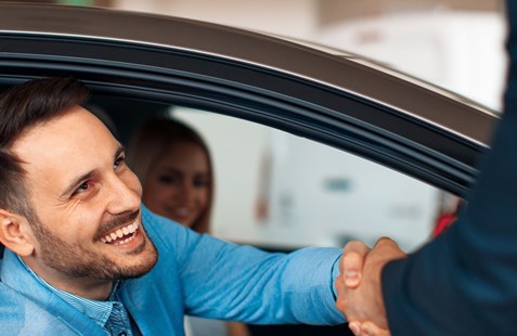 man buying a used car