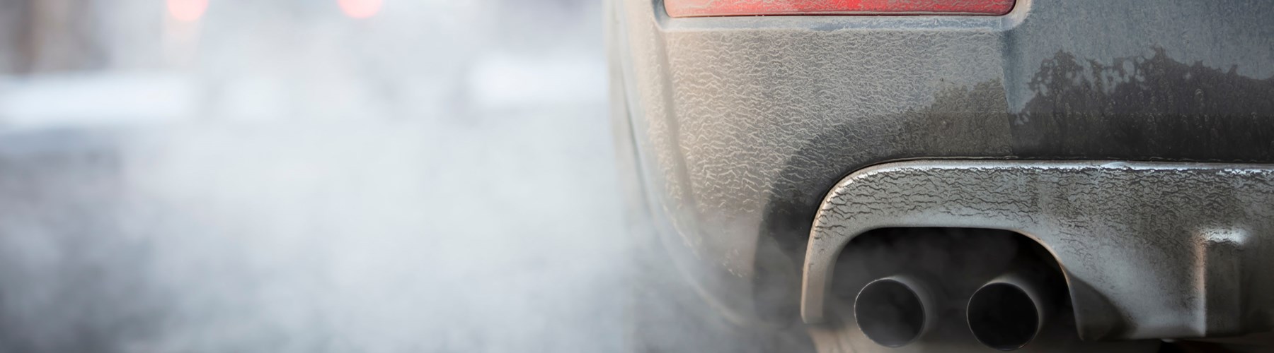 A car idling pumping out fuel