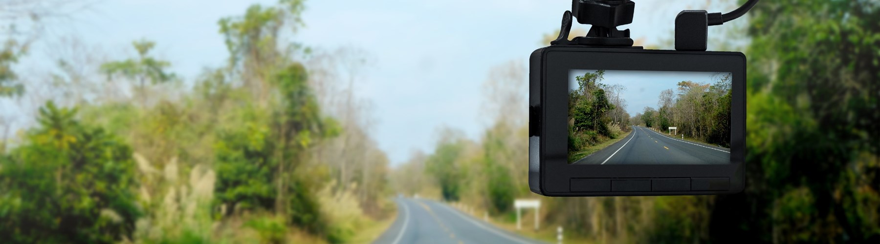 Car with dash cam on countryside road