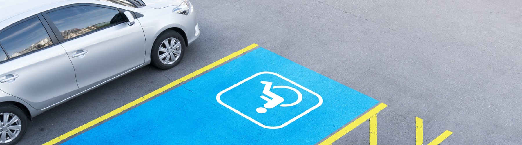 Blue and yellow disabled parking space