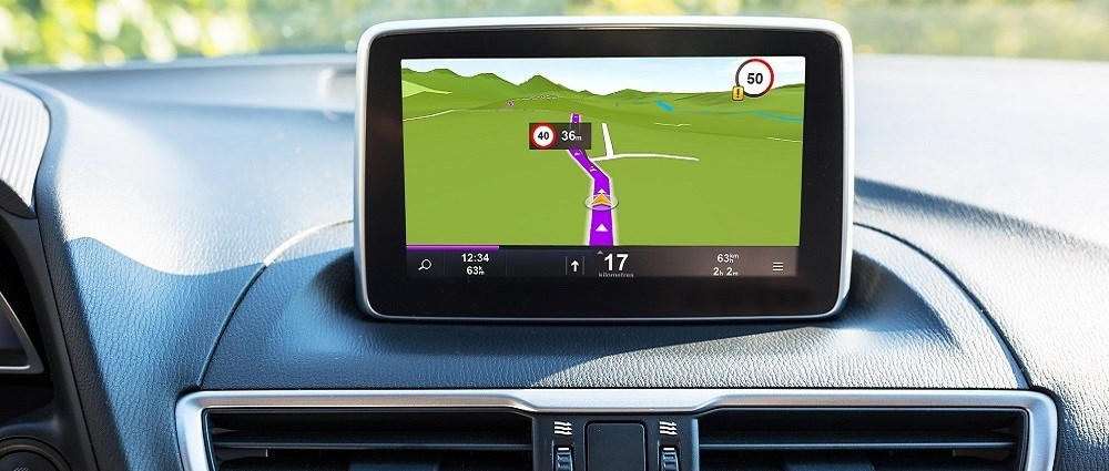 A driverless car with a sat nav on the dashboard