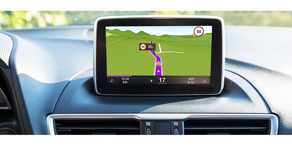 A driverless car with a sat nav on the dashboard