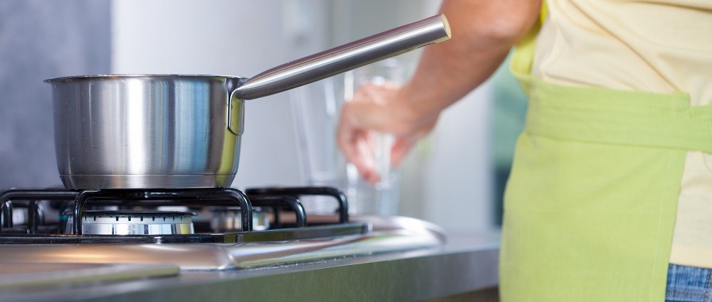 A silver pan on a hob
