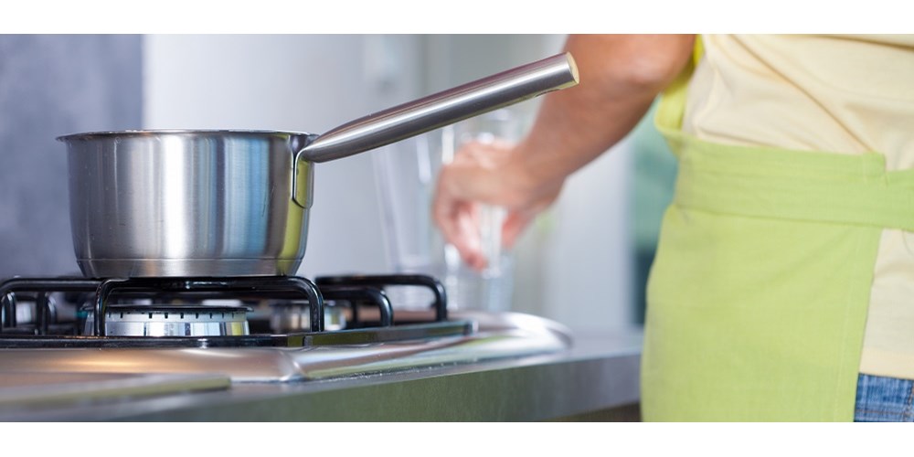 A silver pan on a hob