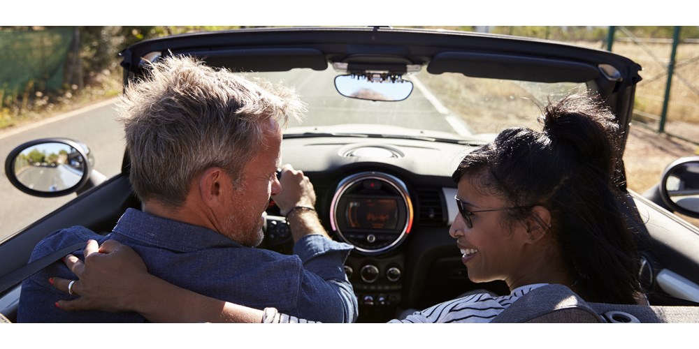 Couple driving in car