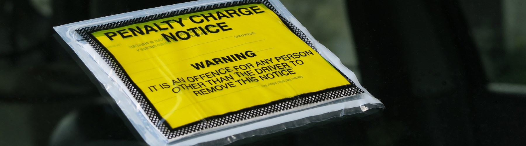 Penalty charge notice on car windshield