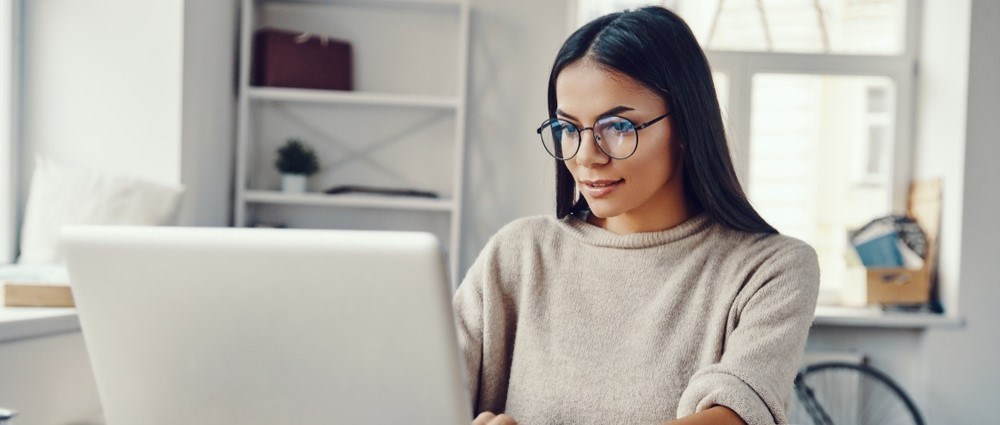 young woman in front of laptop