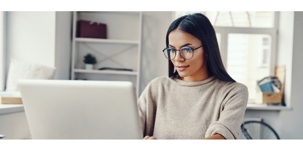 young woman in front of laptop