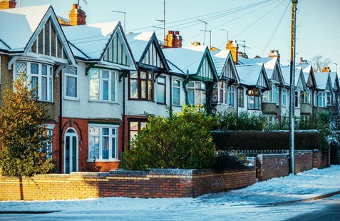 row of houses on snowy street