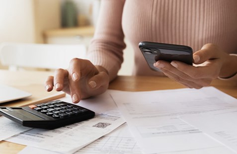 women with a calcuator and papers
