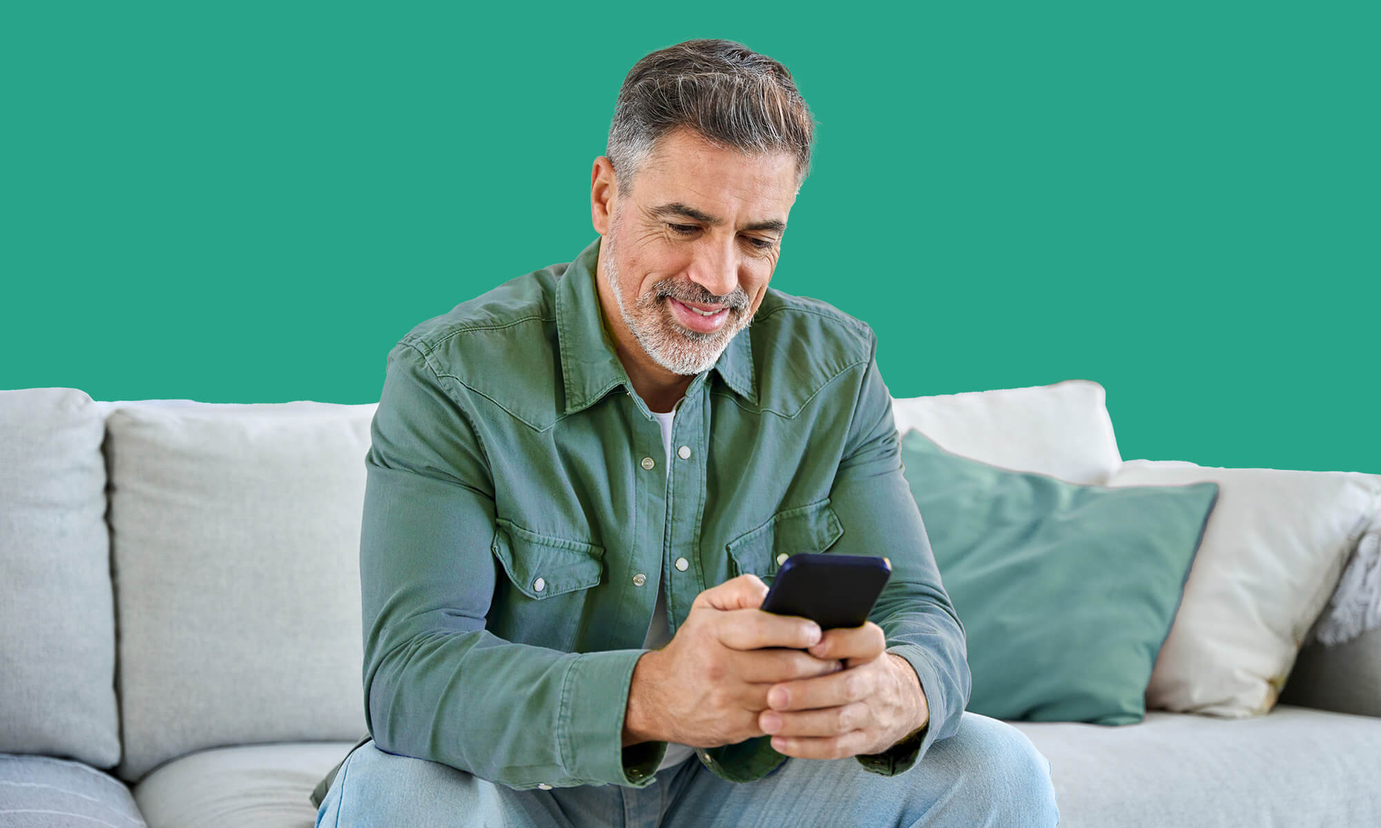 Young woman and man looking at a computer in a living room